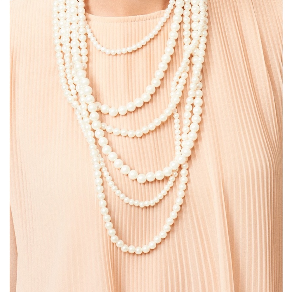 Multi-strand faux pearl layer necklace.